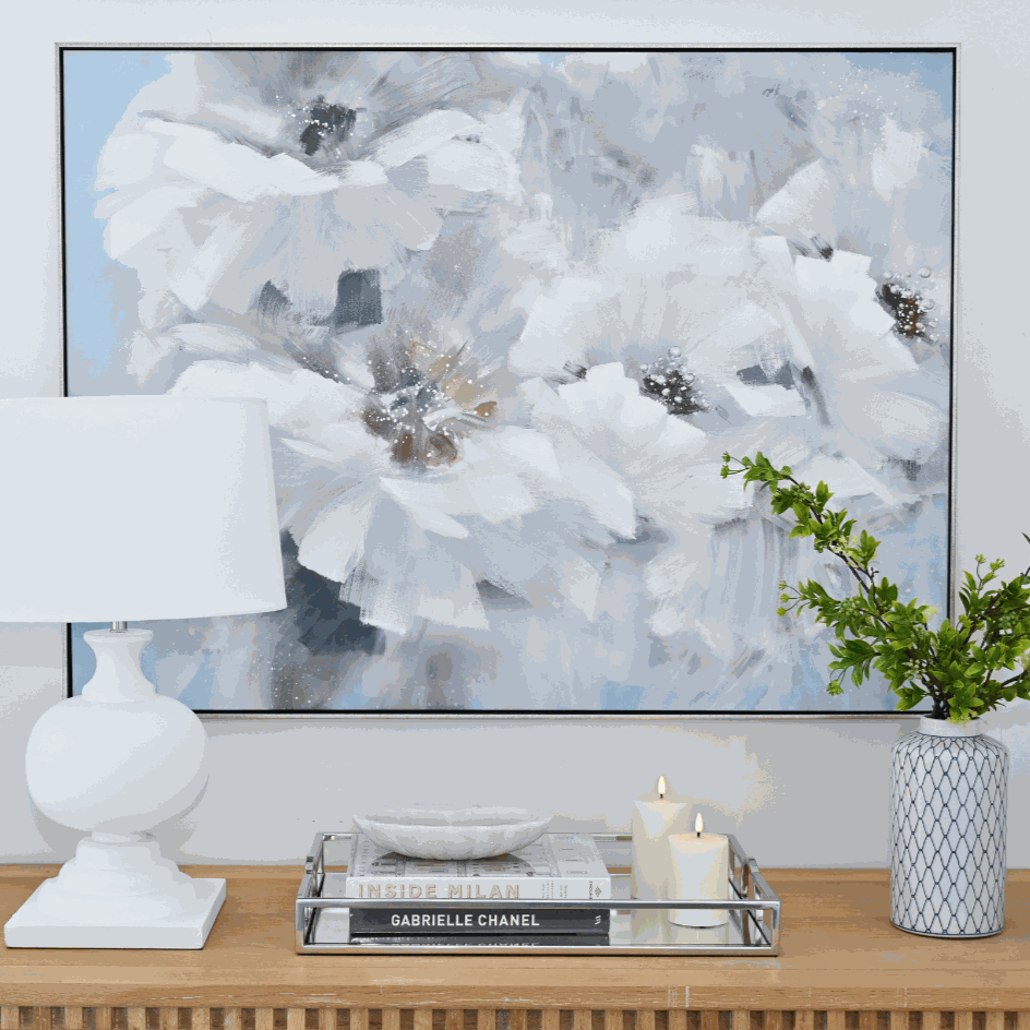 Large canvas artwork featuring an abstract interpretation of florals. Hand painted free brush strokes bring this blue and white artwork to life